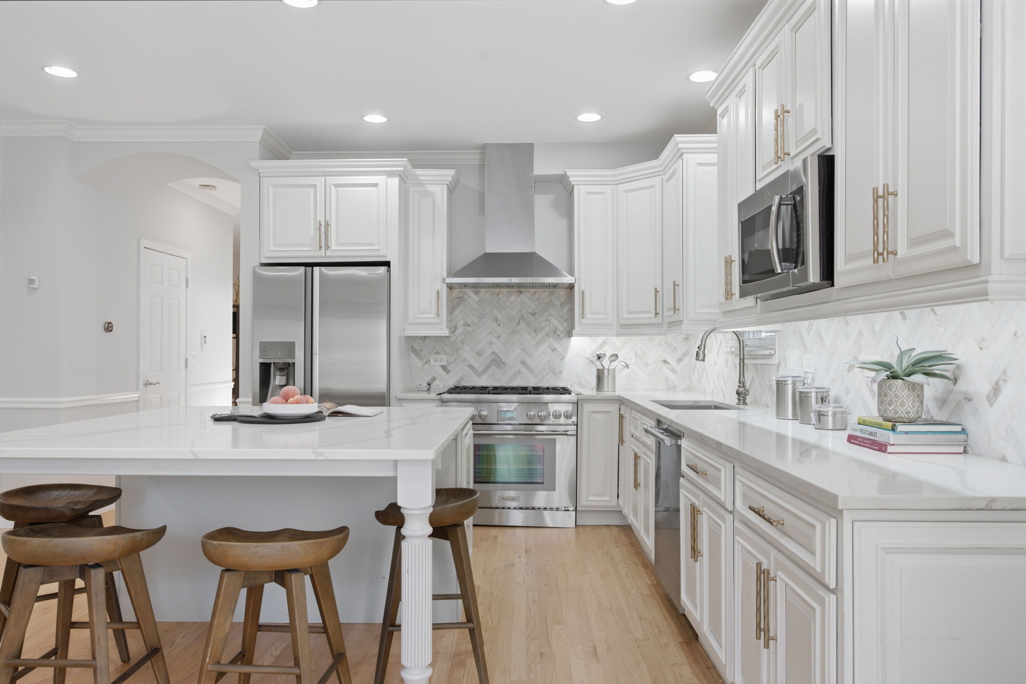 Kitchen with island and range hood