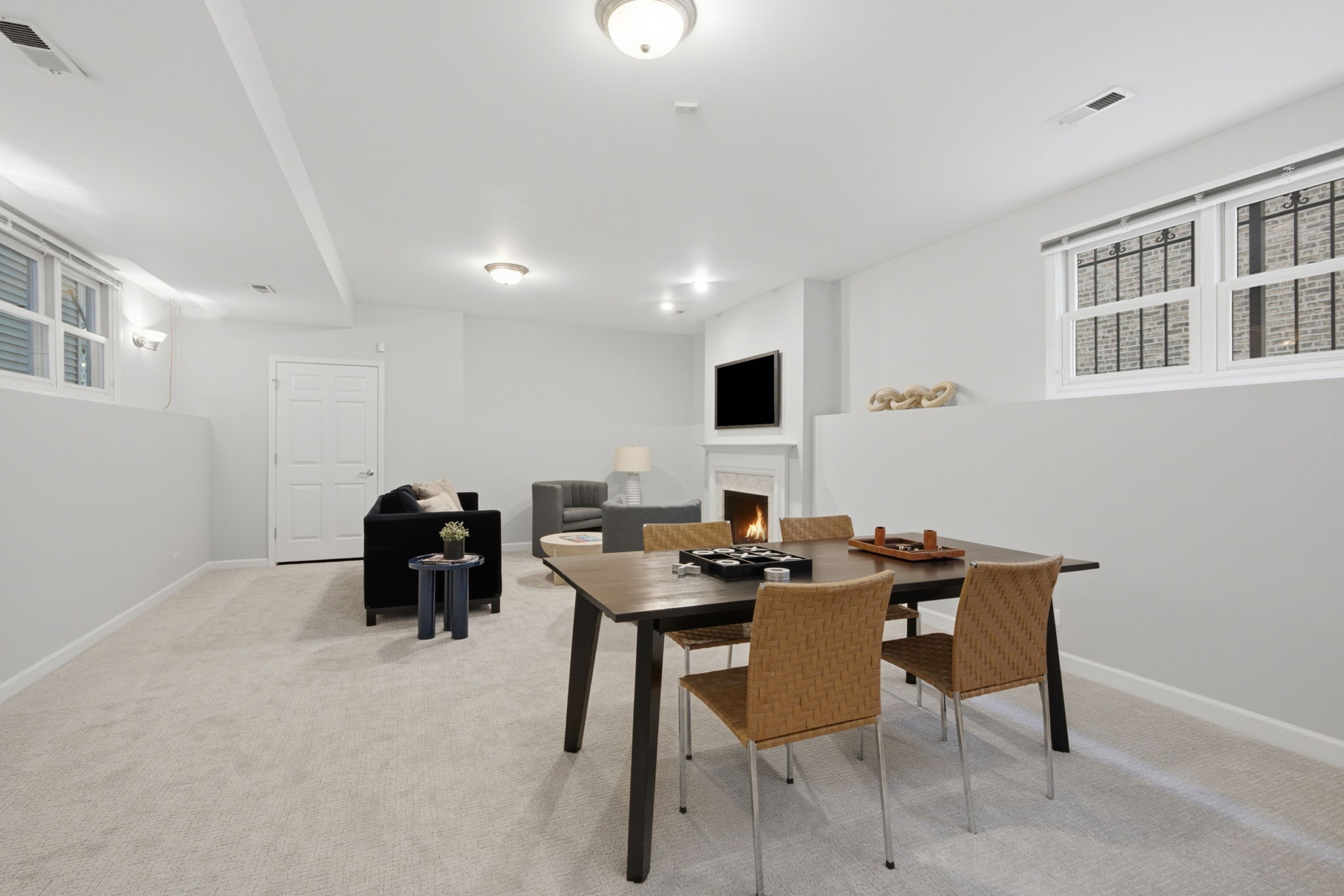 Lower level recreation room with fireplace