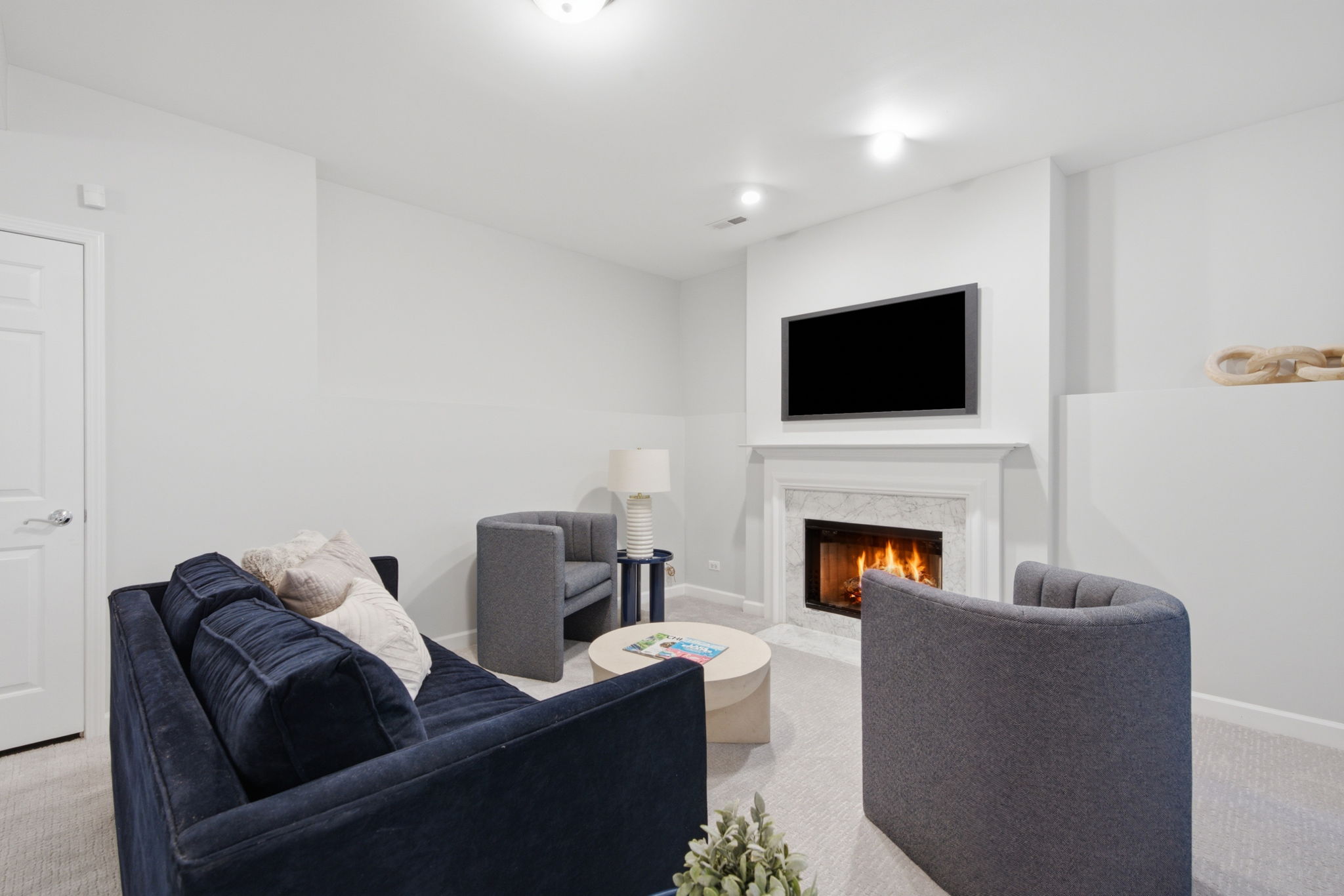 Rec room seating and fireplace